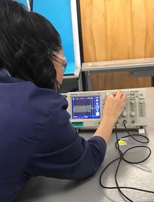 Justina reviewing test equipment